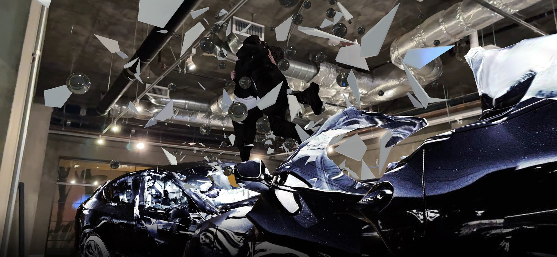 Encounter/Reflection in the West Hollywood space: wrecked cars, a suspended figure and glass shards beneath the ceiling ducts.